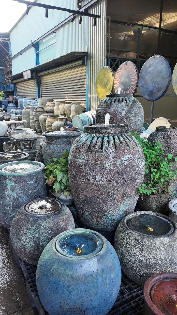 Lava stone-finish jar fountains with running water